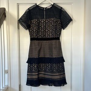 Chelsea 28 dress. Navy lace w/ nude underlay and black velvet belt. Size Small.
